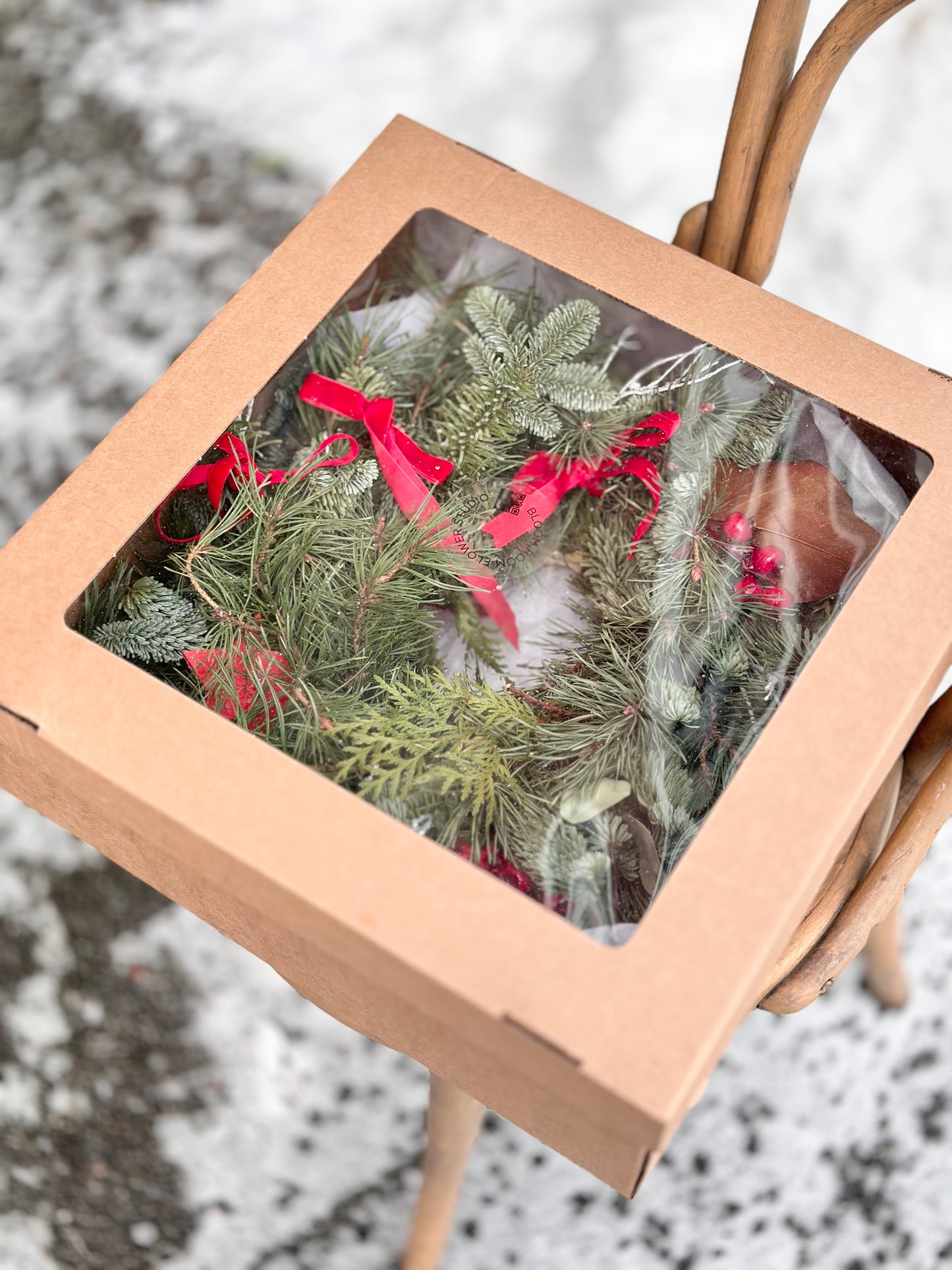 Christmas wreath with natural decor and gift box