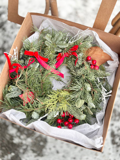 Christmas wreath with natural decor and gift box