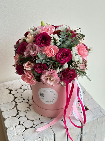 Mini Bloom Box “Blushing Heart” with cerise and pink spray roses, carnations, eustoma and limonium in a pink Bloom Room hat box