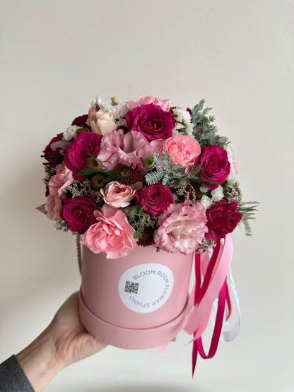 Mini Bloom Box “Blushing Heart” with cerise and pink spray roses, carnations, eustoma and limonium in a pink Bloom Room hat box
